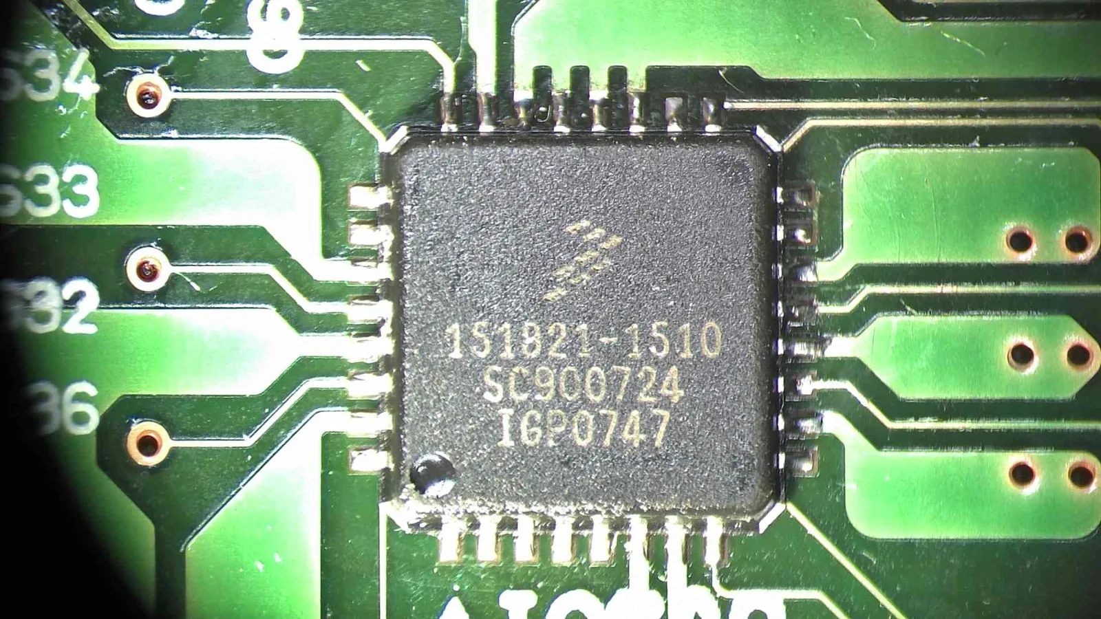 Microscope view of the IC608 injector driver on a Subaru ECM circuit board
