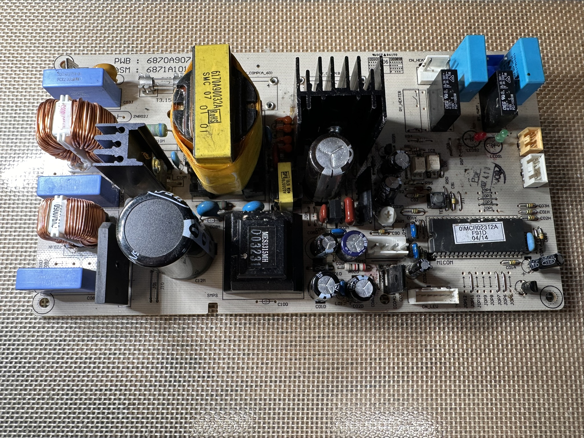 Appliance control board on a repair bench